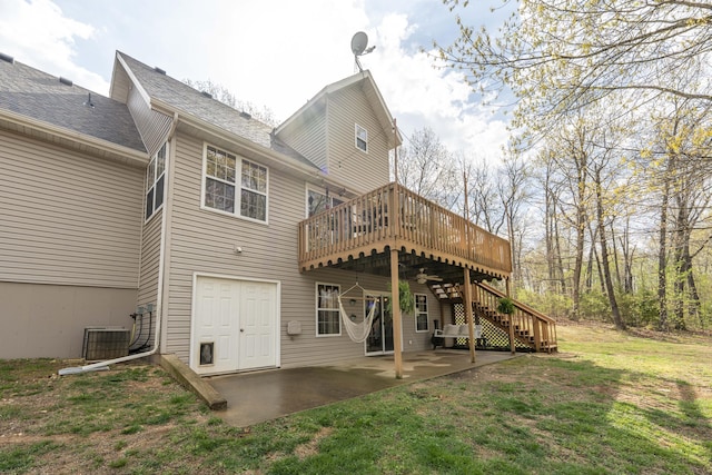 50 Tall Tree Dr, Strafford, MO 65757 - back of property with stairs, a yard, central AC, a patio area, and a deck