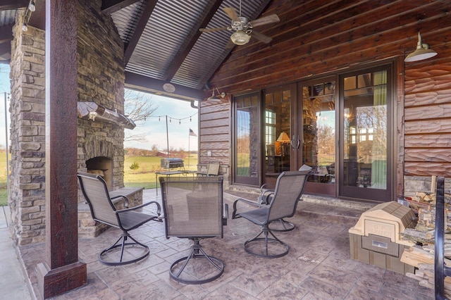 231 Cedar Stone, Ozark, MO 65721 - view of patio / terrace with ceiling fan and an outdoor stone fireplace