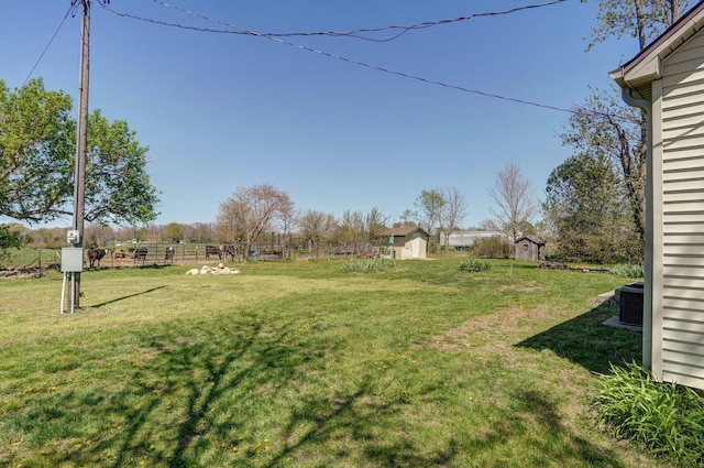 231 Cedar Stone, Ozark, MO 65721 - view of yard with fence, a rural view, an outdoor structure, and a storage shed