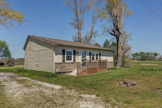 231 Cedar Stone, Ozark, MO 65721 - view of front of property with stone siding, a wooden deck, and a front yard