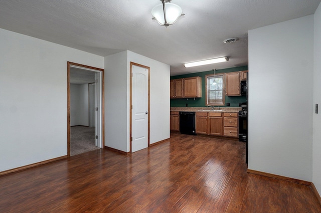 231 Cedar Stone, Ozark, MO 65721 - kitchen with dark wood-style floors, a sink, visible vents, baseboards, and black appliances