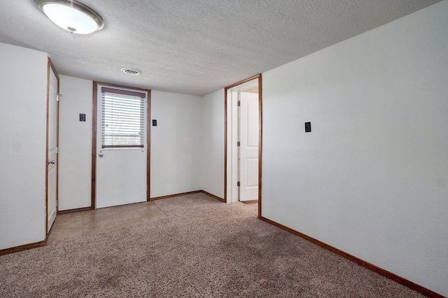 231 Cedar Stone, Ozark, MO 65721 - empty room with light colored carpet, baseboards, a textured ceiling, and visible vents