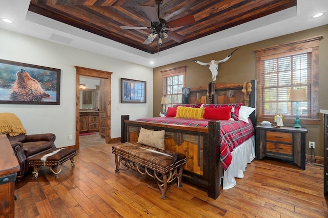 231 Cedar Stone, Ozark, MO 65721 - bedroom featuring baseboards, recessed lighting, visible vents, hardwood / wood-style floors, and a raised ceiling