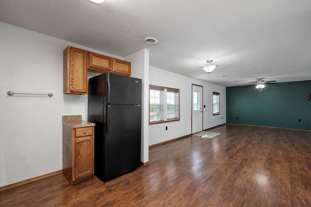 231 Cedar Stone, Ozark, MO 65721 - kitchen featuring dark wood finished floors, a ceiling fan, freestanding refrigerator, baseboards, and brown cabinetry