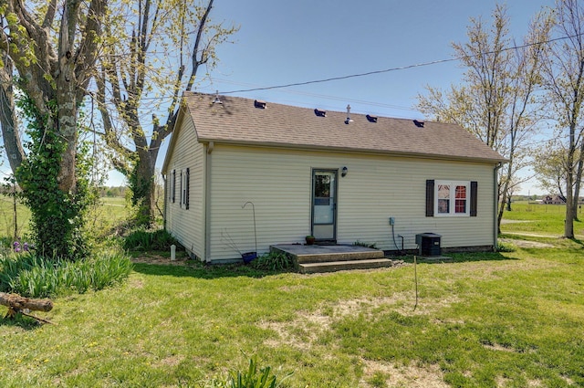231 Cedar Stone, Ozark, MO 65721 - rear view of house featuring a lawn, central AC, and roof with shingles