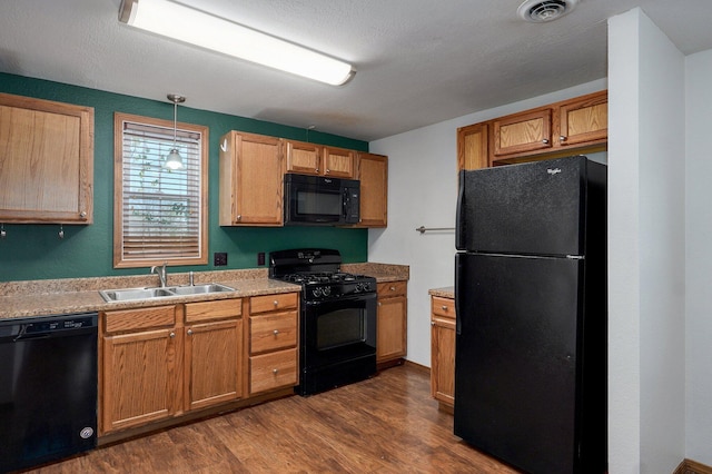 231 Cedar Stone, Ozark, MO 65721 - kitchen with a sink, black appliances, light countertops, dark wood-style flooring, and visible vents