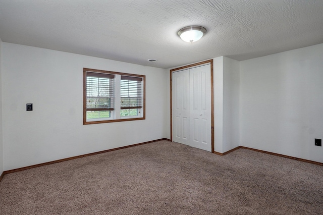 231 Cedar Stone, Ozark, MO 65721 - unfurnished bedroom featuring baseboards, a closet, a textured ceiling, and carpet