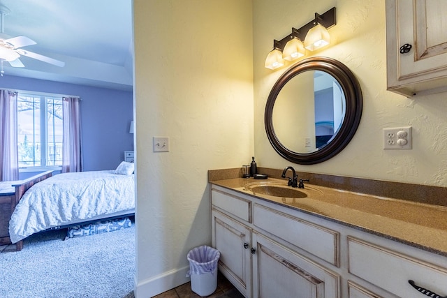 19800 Providence Dr, Lebanon, MO 65536 - bathroom with a ceiling fan, vanity, baseboards, ensuite bath, and tile patterned flooring