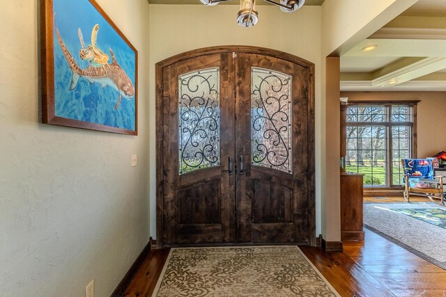 19800 Providence Dr, Lebanon, MO 65536 - foyer with hardwood / wood-style floors, baseboards, and an inviting chandelier