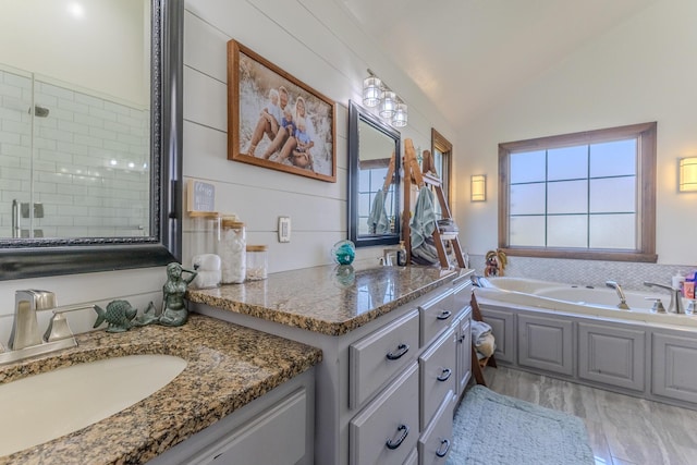 19800 Providence Dr, Lebanon, MO 65536 - full bath featuring a garden tub, wood finished floors, a sink, lofted ceiling, and tiled shower
