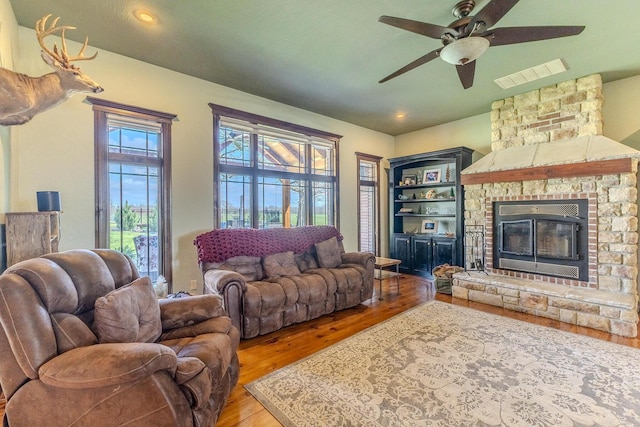 19800 Providence Dr, Lebanon, MO 65536 - living area with visible vents, recessed lighting, wood finished floors, ceiling fan, and a fireplace