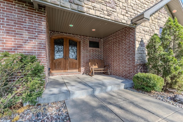 19800 Providence Dr, Lebanon, MO 65536 - entrance to property with brick siding, a porch, and stone siding