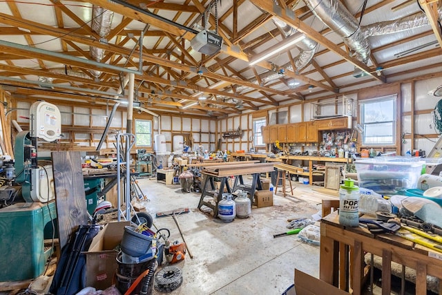 19800 Providence Dr, Lebanon, MO 65536 - miscellaneous room with lofted ceiling, concrete floors, a workshop area, and a healthy amount of sunlight