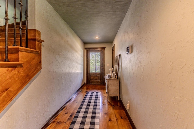 19800 Providence Dr, Lebanon, MO 65536 - doorway with hardwood / wood-style flooring, baseboards, and a textured wall