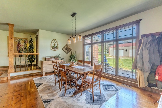 19800 Providence Dr, Lebanon, MO 65536 - dining area with wood-type flooring, visible vents, and plenty of natural light