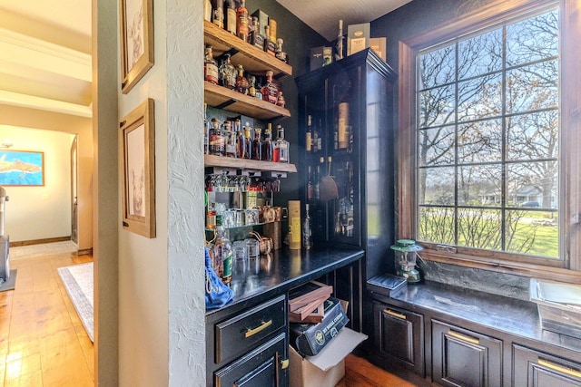 19800 Providence Dr, Lebanon, MO 65536 - bar featuring wood finished floors, a wealth of natural light, and a bar