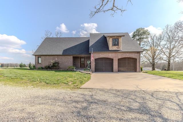 19800 Providence Dr, Lebanon, MO 65536 - french country inspired facade with a shingled roof, brick siding, a front yard, and concrete driveway