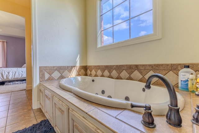 19800 Providence Dr, Lebanon, MO 65536 - ensuite bathroom with tile patterned floors, ensuite bath, and a whirlpool tub