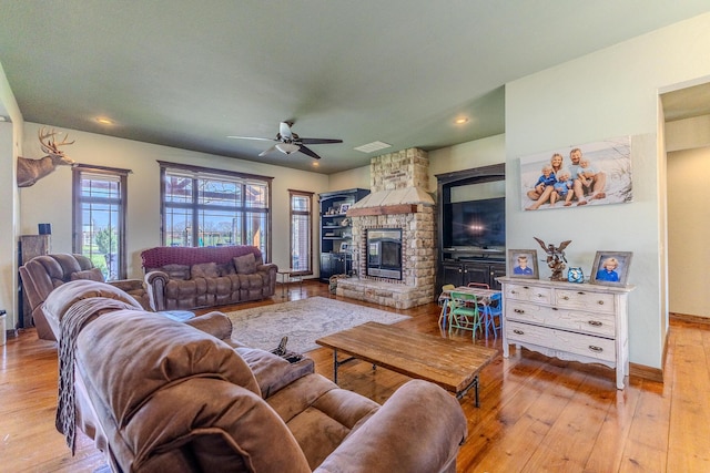 19800 Providence Dr, Lebanon, MO 65536 - living area featuring hardwood / wood-style floors, a ceiling fan, a fireplace, and recessed lighting