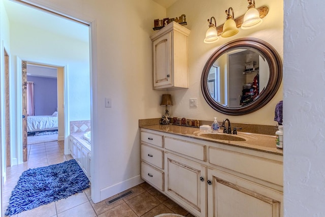 19800 Providence Dr, Lebanon, MO 65536 - ensuite bathroom featuring a washtub, ensuite bathroom, vanity, tile patterned flooring, and visible vents