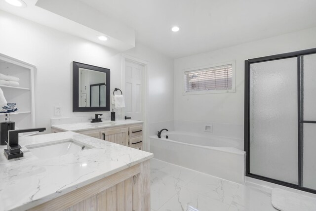 bathroom featuring recessed lighting, marble finish floor, a shower stall, a garden tub, and vanity