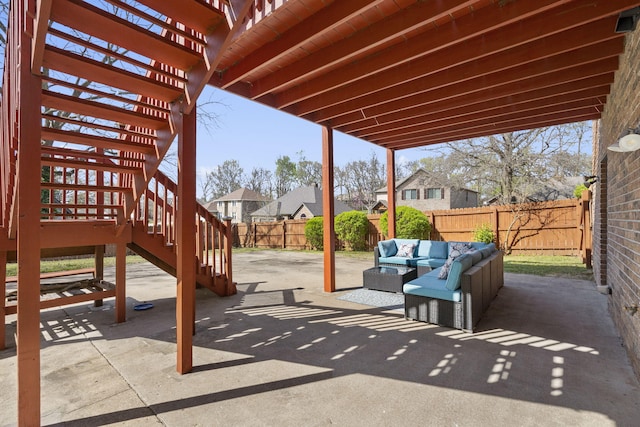 view of patio featuring a fenced backyard and an outdoor living space