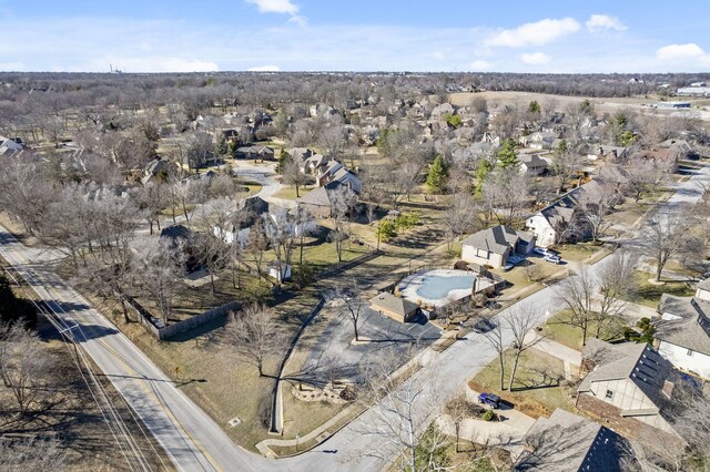 birds eye view of property with a residential view