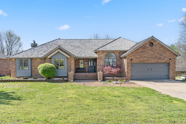 single story home featuring brick siding, an attached garage, a front lawn, and driveway