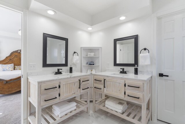 full bath featuring marble finish floor, vanity, connected bathroom, and recessed lighting