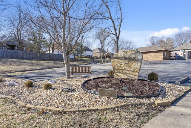 exterior space with curbs and a residential view