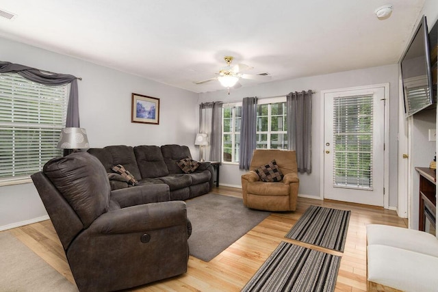 720 Fall Creek Dr Unit 3, Branson, MO 65616 - living area with wood finished floors, a ceiling fan, and baseboards