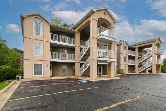 720 Fall Creek Dr Unit 3, Branson, MO 65616 - view of apartment building / complex with uncovered parking