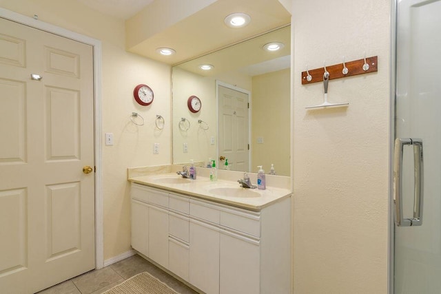 720 Fall Creek Dr Unit 3, Branson, MO 65616 - bathroom with tile patterned floors, double vanity, and recessed lighting