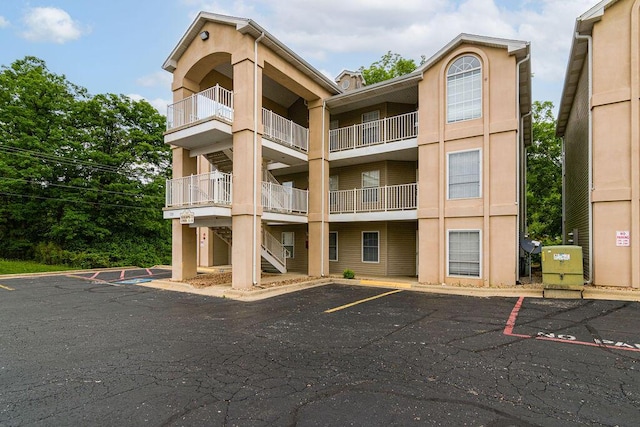 720 Fall Creek Dr Unit 3, Branson, MO 65616 - view of apartment building / complex with uncovered parking and stairway