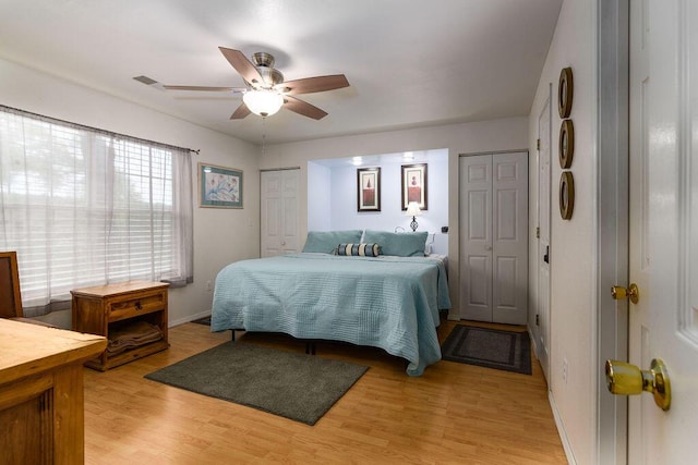 720 Fall Creek Dr Unit 3, Branson, MO 65616 - bedroom featuring light wood-style floors, baseboards, ceiling fan, and two closets