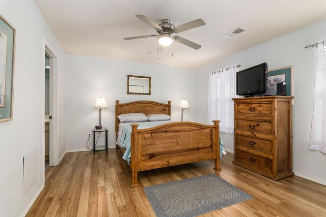 720 Fall Creek Dr Unit 3, Branson, MO 65616 - bedroom with light wood-style flooring, baseboards, and a ceiling fan