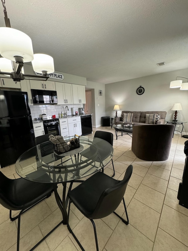 27 Fall Creek Dr, Branson, MO 65616 - dining area with a textured ceiling and light tile patterned floors