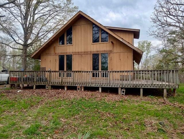 rear view of property with a wooden deck