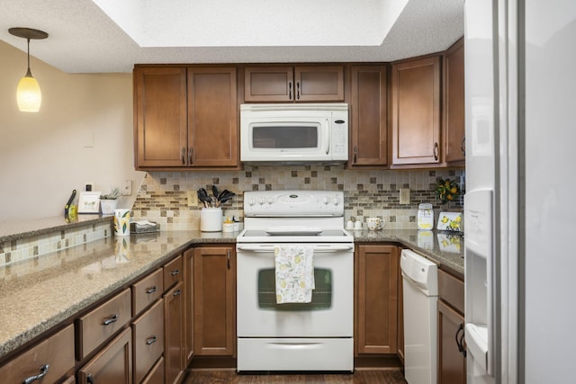 67 Port Dr Unit 7, Kimberling City, MO 65686 - kitchen featuring white appliances, brown cabinets, and decorative backsplash