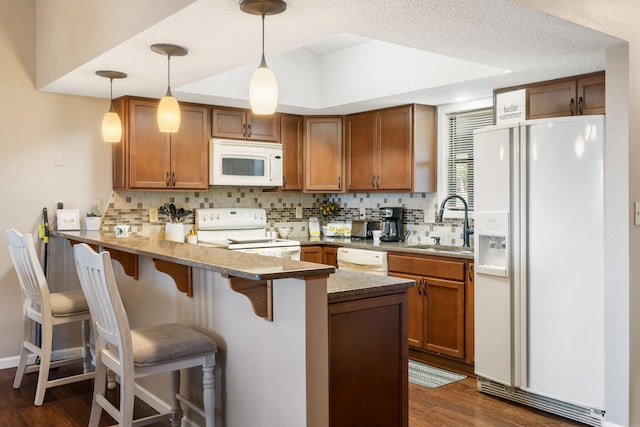 67 Port Dr Unit 7, Kimberling City, MO 65686 - kitchen with tasteful backsplash, white appliances, a peninsula, and a sink
