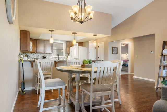 67 Port Dr Unit 7, Kimberling City, MO 65686 - dining area with dark wood finished floors, baseboards, and an inviting chandelier