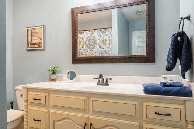 67 Port Dr Unit 7, Kimberling City, MO 65686 - bathroom featuring toilet, visible vents, and vanity