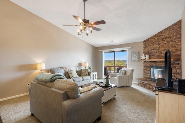 67 Port Dr Unit 7, Kimberling City, MO 65686 - living area featuring lofted ceiling, a ceiling fan, a stone fireplace, and light carpet