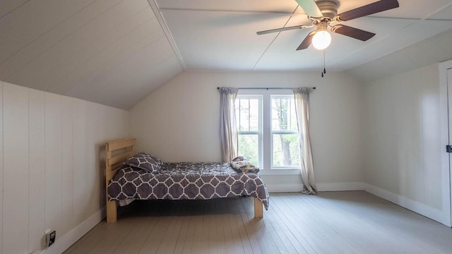 bedroom featuring lofted ceiling, ceiling fan, light wood finished floors, and baseboards