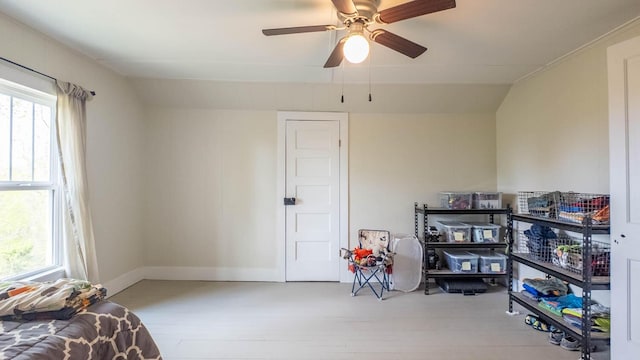 interior space with ceiling fan