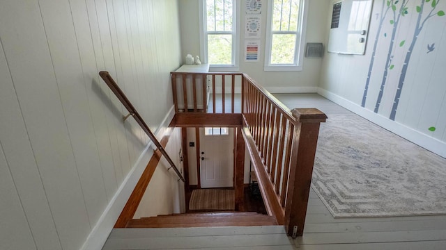 stairway with carpet and baseboards