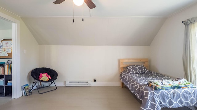 bedroom with ceiling fan, vaulted ceiling, wood finished floors, and a baseboard radiator