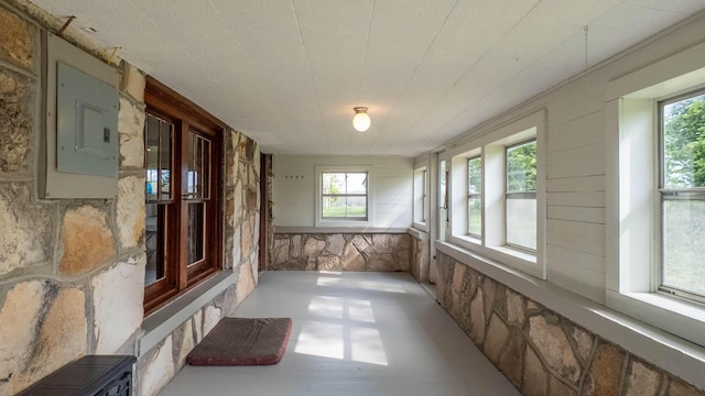 unfurnished sunroom featuring electric panel