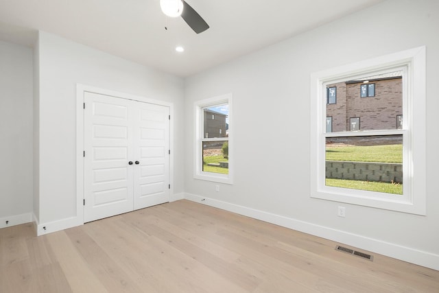 5913 S Clay Ave, Springfield, MO 65810 - unfurnished bedroom featuring light wood-type flooring, a closet, visible vents, and baseboards