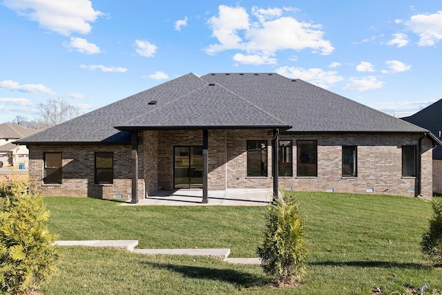 5913 S Clay Ave, Springfield, MO 65810 - rear view of house featuring a lawn, a shingled roof, a patio area, and brick siding